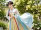 A woman in a blue and yellow hanbok is posing for a picture.